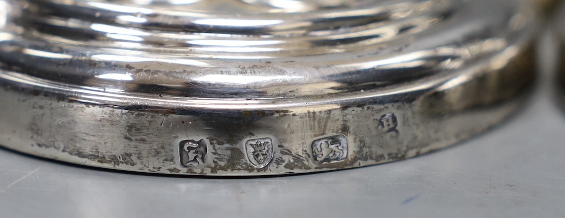 A set of four early George III silver gothic cluster column candlesticks, on cusped quatrefoil bases, by Hannam or Hammond & Carter, London, 1763, 28.8cm, weighted (holes).